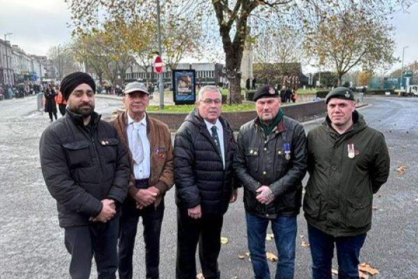 Image depicts five veterans standing together at Walsall town centre Bradford Place.