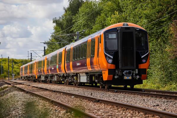 an orange train on a track