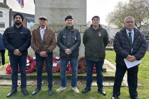 Image depicts five veterans in front of the Walsall town centre cenotaph.