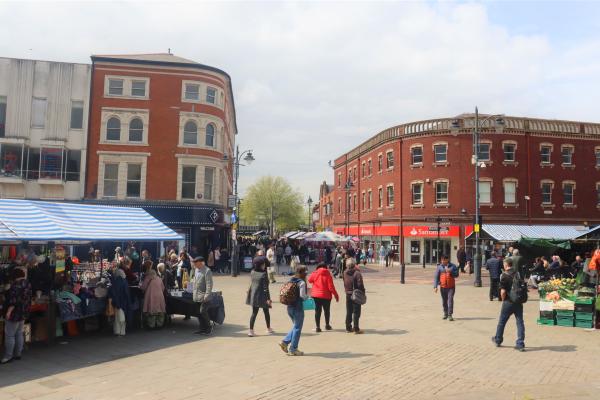 Walsall Continental Market stalls and people attending 