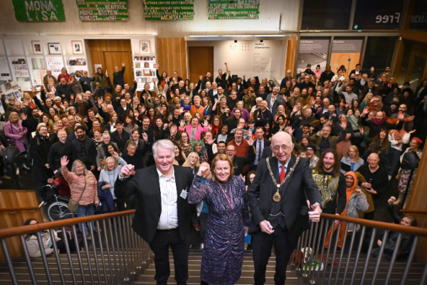 The Director of the Gallery, Chief Exec of Walsall Council and Mayor of Walsall celebrating in front of a crowd of visitors inside the Gallery