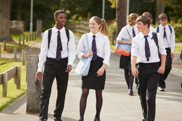 secondary school offer day - tree teenagers walking