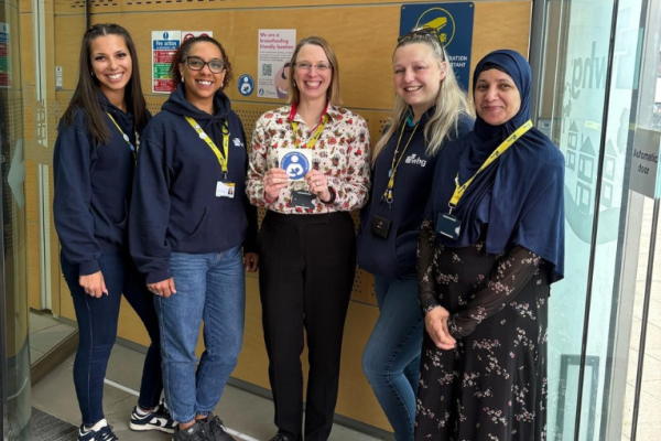 Image depicts five colleagues from whg promoting breastfeeding friendly at their headquarters in Walsall.