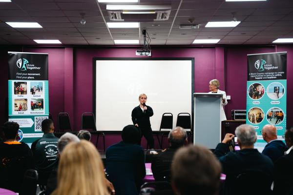 Image depicts Ellie Simmonds MBE speaking at the Move Together launch event.