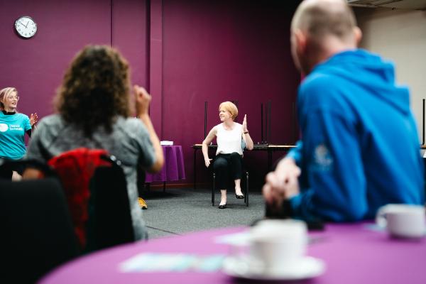Image depicts Wendy Morton MP taking part in a group exercise at the Move Together campaign launch.