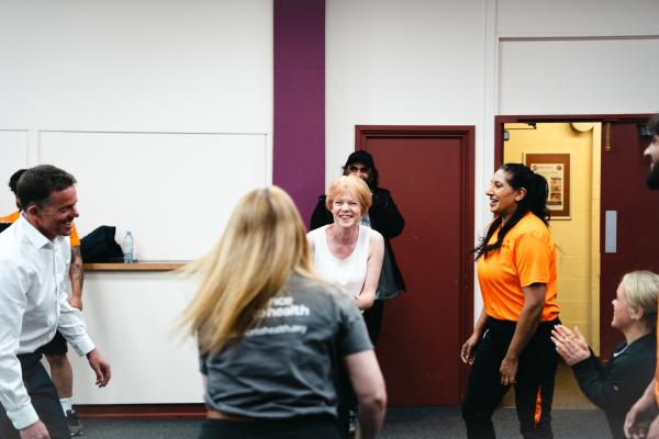 Image depicts Wendy Morton MP taking part in a group exercise.