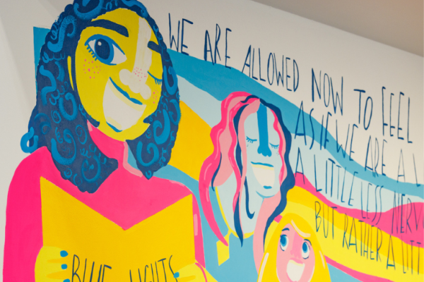 Colourful mural of the Blue Lights Choir at the Gallery