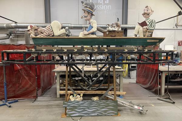 The three men in a boat automaton standing on a frame in a workshop