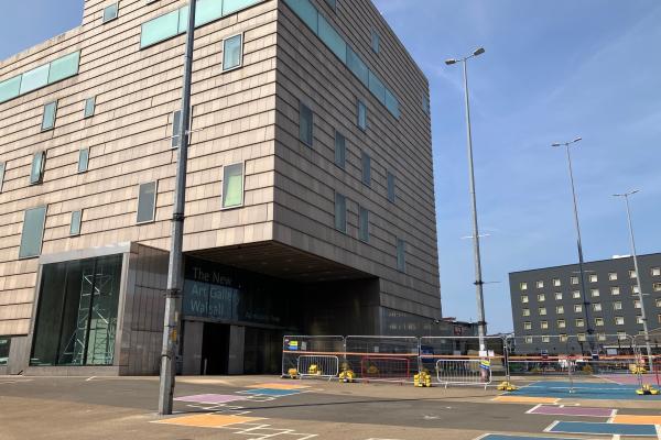 View of The New Art Gallery Walsall from Gallery Square with fencing in the square