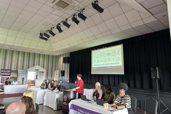 Image depicts Nadia Inglis, Director of Public Health speaking at the Neurodiversity Conference.