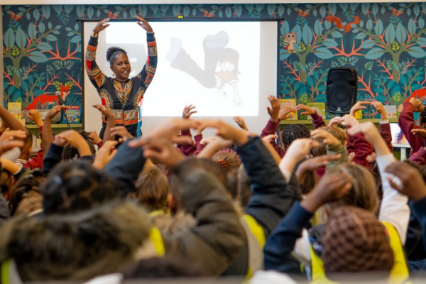 Black British Ballet Exhibition session, teacher showing dance moves to children
