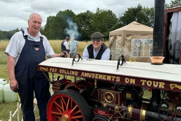 Traction engine with engineers in overalls