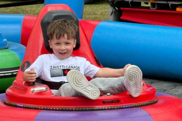 A child enjoying an amusement ride