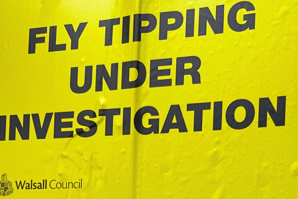 fly tipping under investigation yellow sign