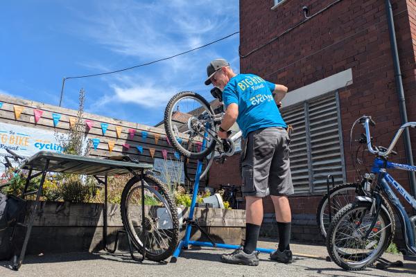 Dr. Bike performing safety checks and fixes 