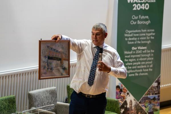 Steve Smith speaking at a conference 