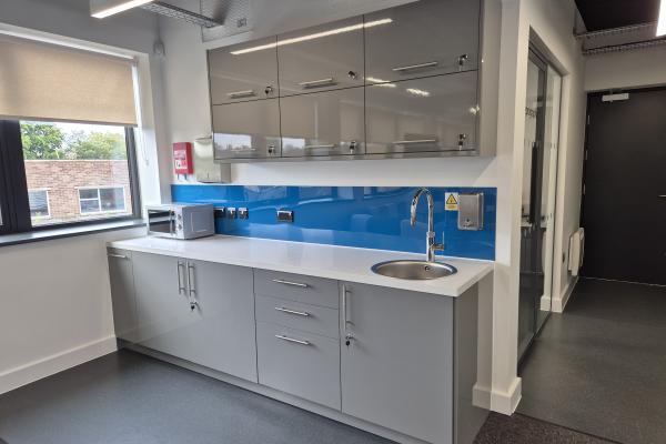 A blue and grey kitchen area