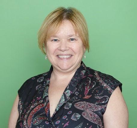 Sally Rowe, the Director of Children's Services in-front of green background