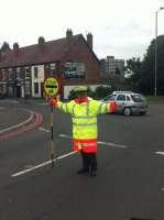 Traffic warden at school crossing